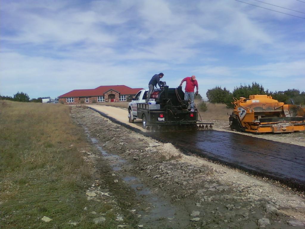 tar%20%26%20chip,asphalt%20being%20applied_full.jpeg