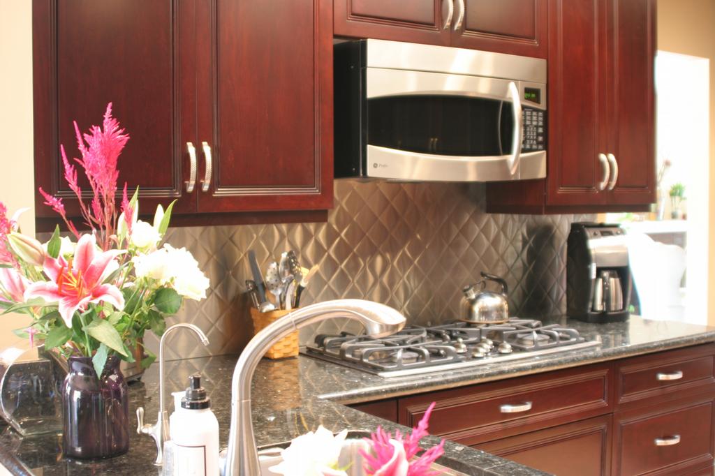 Backsplash Idea for Dark Cabinets  about the details of wood