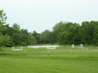 Our jump field and dressage arena. by Cedar Ridge Farm - Children's Horseback Riding Lessons Greenville 47124 