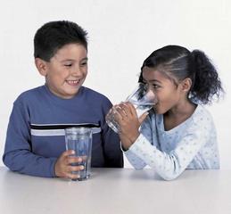 kids drinking water from glasses