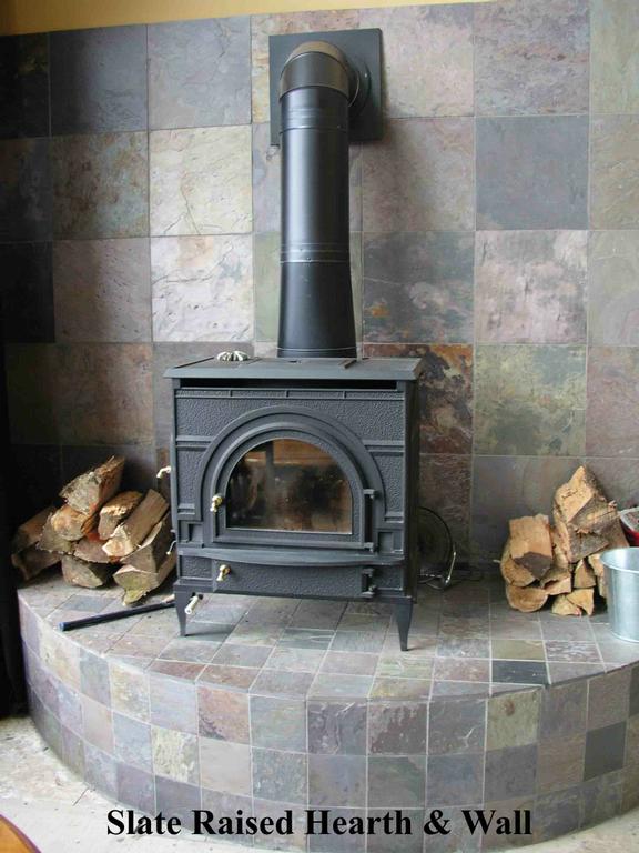 Custom Slate Design Raised Hearth for Wood Stove & Bench by The Sandel 