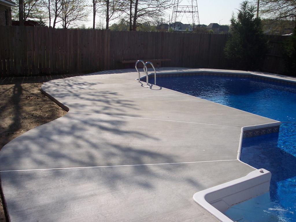 Broom Finish pool decking from Custom Concrete Construction Company in