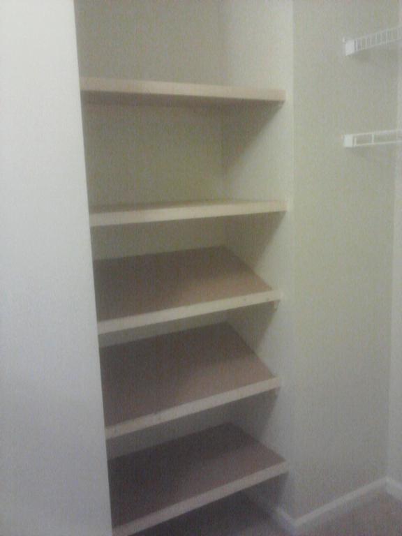 Custom closet shelves and shoe rack from General Repairs LLC a home