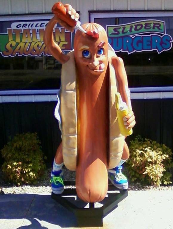 Hot Dog Man in front of Store by Mickey's 76 Drive In