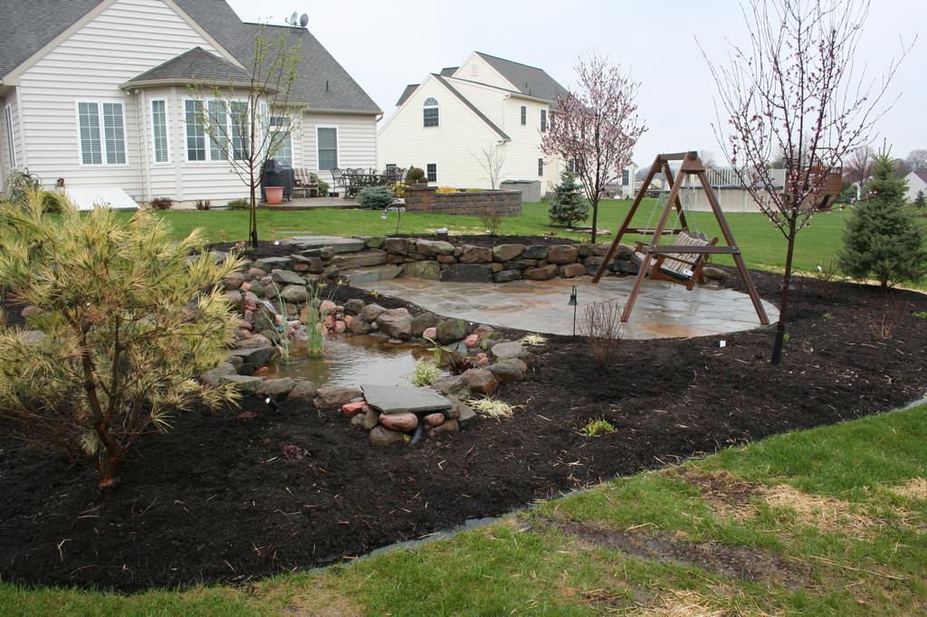 Flagstone Patio & Fish Pond from Willow Gates Landscaping & Pavers in