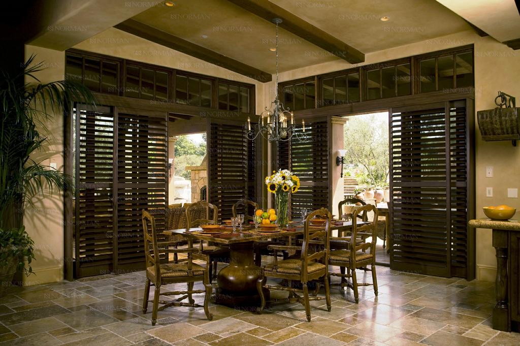 Hardwood Sliding Door Shutters by U S Verticals Manufacturing Incorporated