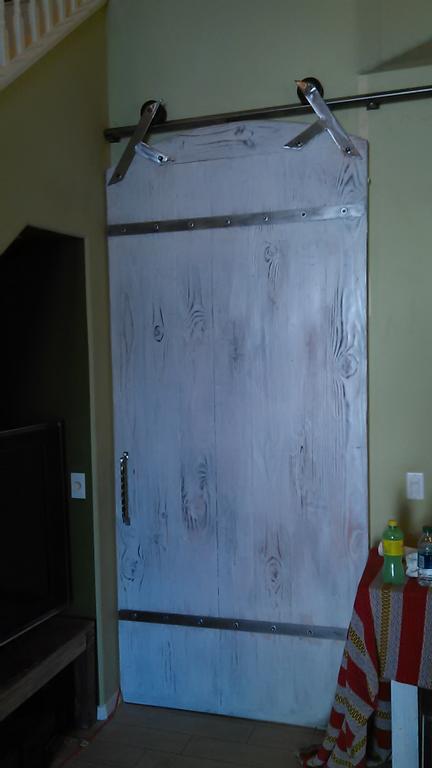 American sliding door and windows rustic white door with an arch top by AMERICAN SLIDING DOOR AND WINDOW