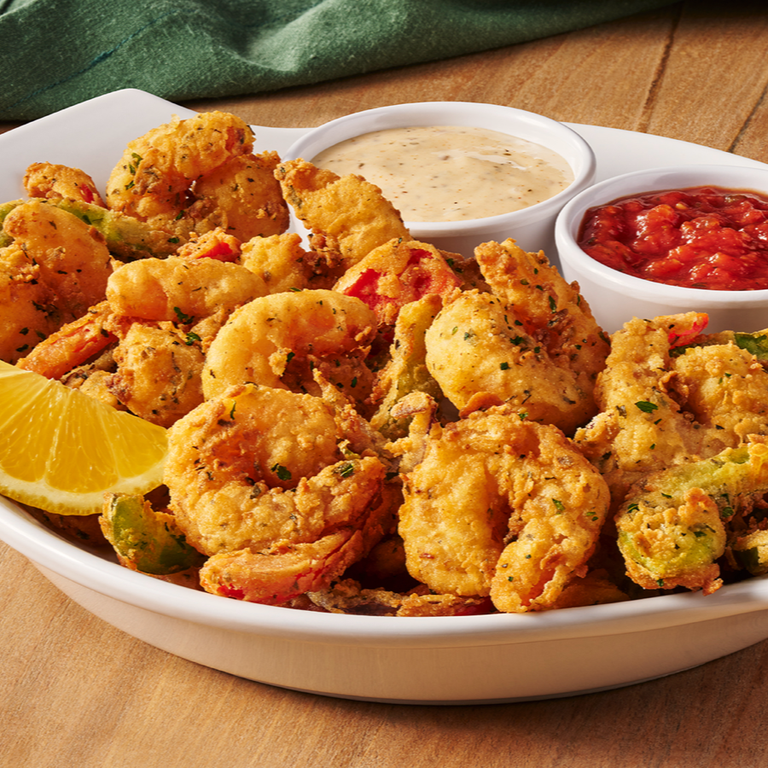 Shrimp Fritto Misto: Over a half pound of shrimp mixed with onions and bell peppers, hand breaded and lightly fried. Served with marinara and spicy ranch. by Olive Garden Italian Restaurant