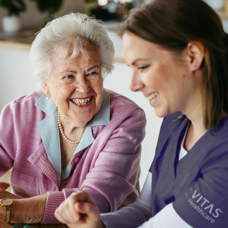 Nurse with hospice patient. by VITAS Healthcare