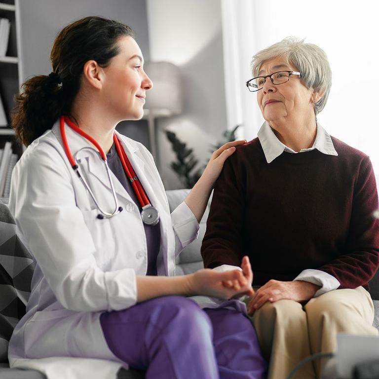 Physician with caregiver. by VITAS Healthcare
