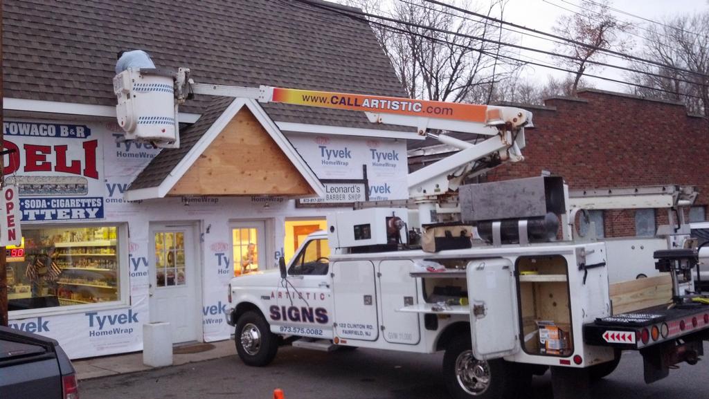 Artistic Signs llc Bucket truck Sign service by Artistic Signs llc
