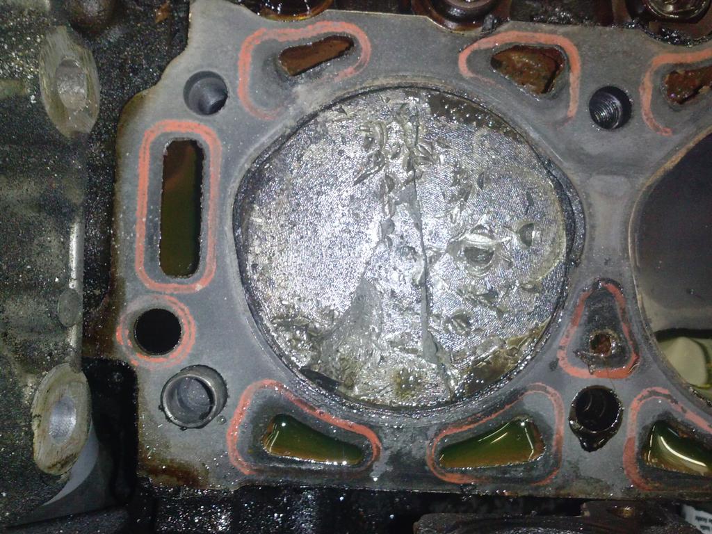 Veiw of Piston still inside engine. by Ask Jims Auto Repair