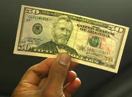 $50 in hand by Total Merchant Services