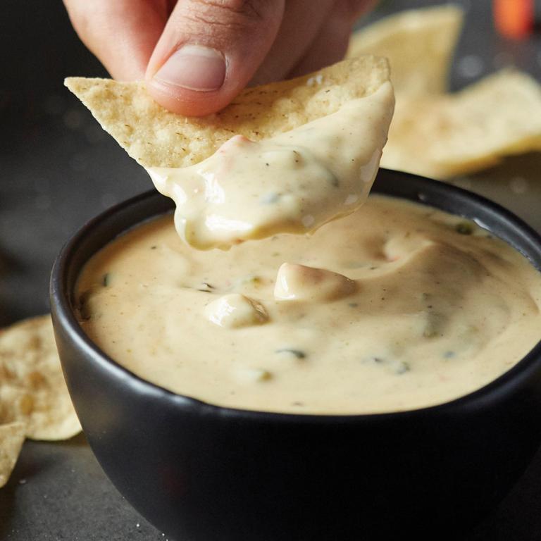 QDOBA's signature 3-cheese queso pairs perfectly with fried in-house tortilla chips or on any entree at no additional charge! by QDOBA Mexican Eats