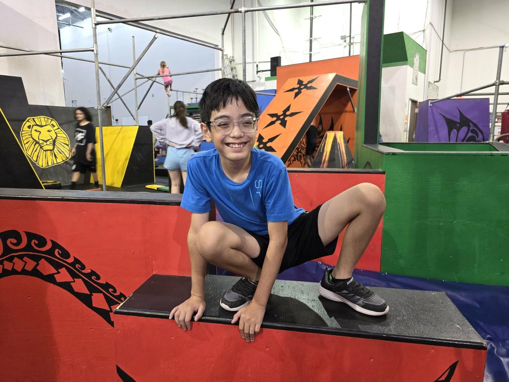 A young boy doing a vault in the parkour section. by The Jungle Movement Academy