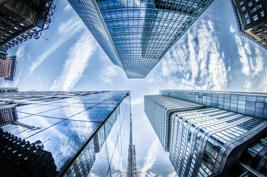 low-angle-photo-of-four-high-rise-curtain-wall-buildings-830891-scaled-1 by Rank Up Digital Marketing Agency