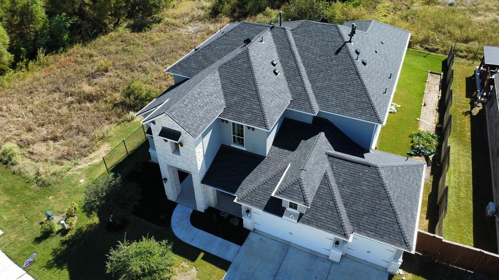 Central Texas roof replacement after hail damage. by Summit Roofing