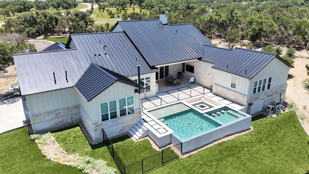 Luxury home metal roof installation completed in Round Rock. by Summit Roofing