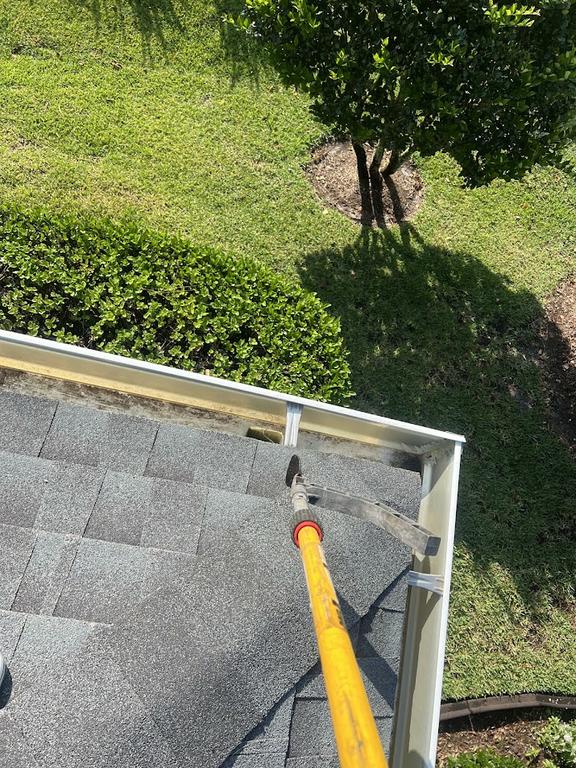 Professional gutter and downspout cleaning in St. Cloud, FL removes leaves, dirt, and accumulated debris to help rainwater flow properly away from your home. by R & R Elite Pressure Washing LLC