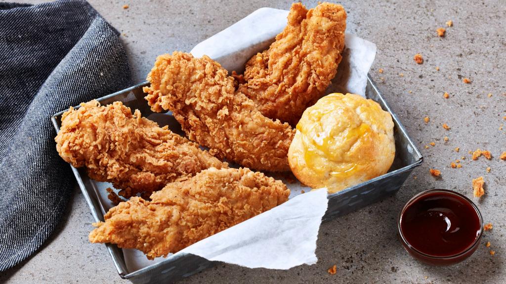 Four crispy chicken tenders served with a honey butter biscuit and dipping sauce - a hearty and satisfying Krispy Krunchy Chicken favorite. by Krispy Krunchy Chicken