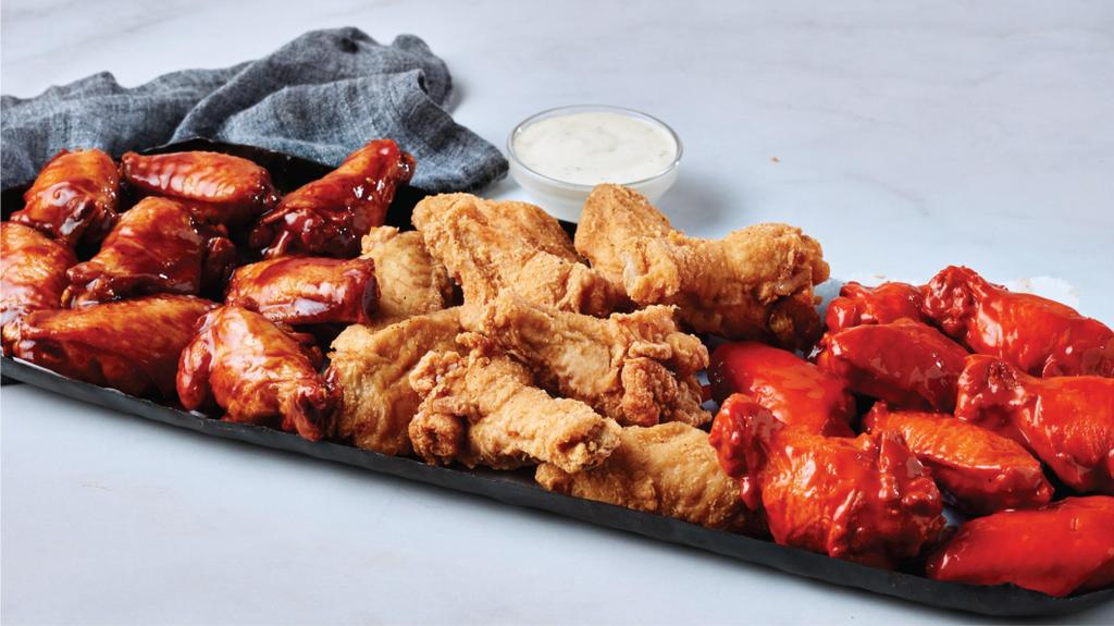 From BBQ to Buffalo to classic fried, our chicken wings platter has something for every flavor lover. Served with dipping sauce for the perfect bite. by Krispy Krunchy Chicken
